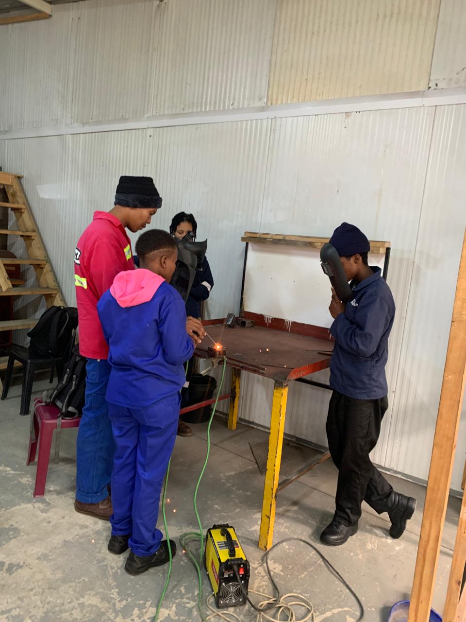 K.O.E.C Centre trainees in a vocational workshop